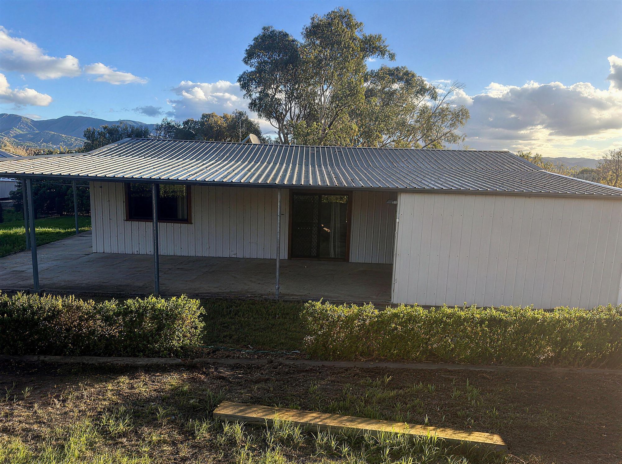 Covered veranda and carport at The Landscapers Rest